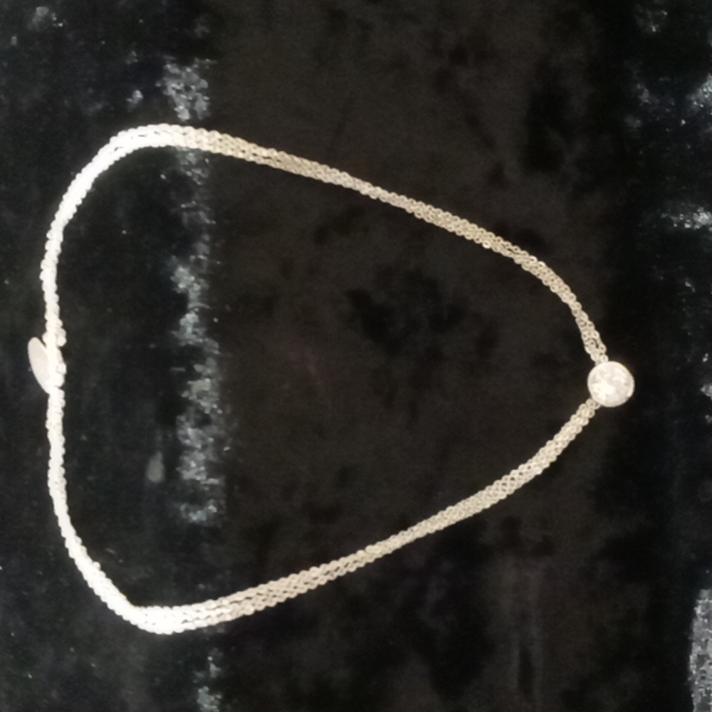 NY necklace Three chains with one diamond .